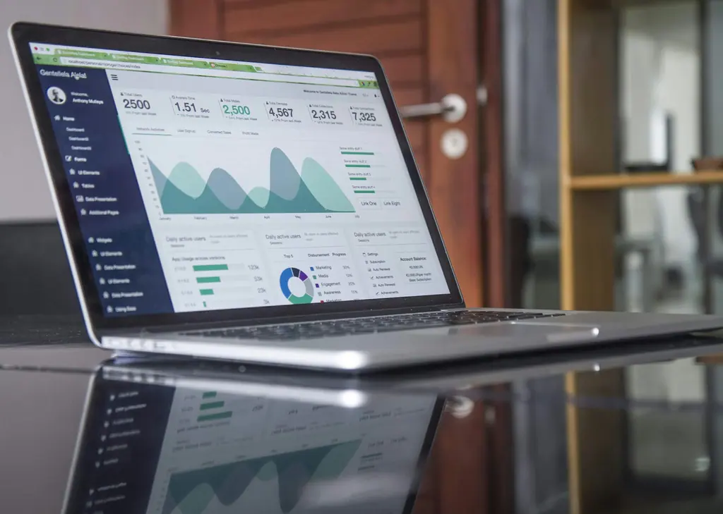 Bookkeeping workspace with transaction listings and a notebook, used as context imagery.
