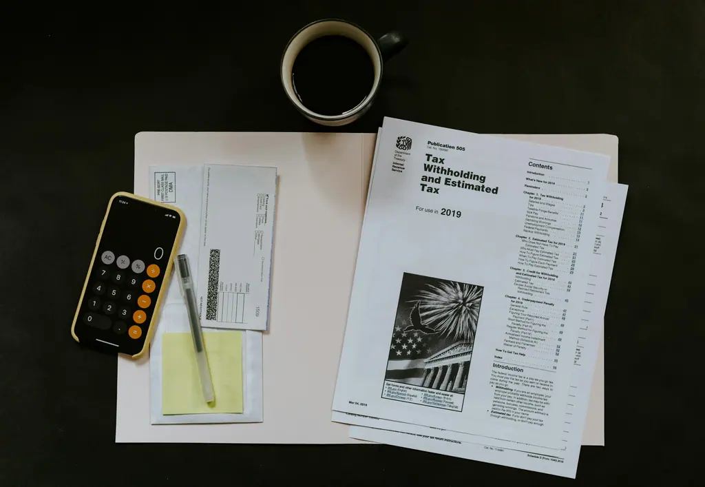 Receipts laid out beside an expense summary for review, used as context imagery.